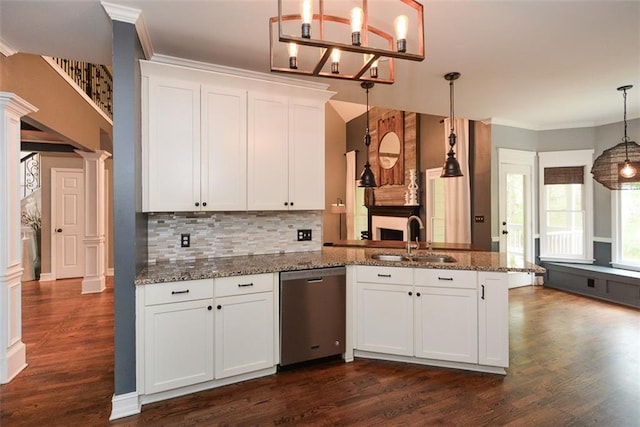 204 Maple Creek Chase, Woodstock, GA 30188 - kitchen with ornamental molding, a peninsula, decorative columns, dishwasher, and a sink