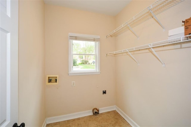 204 Maple Creek Chase, Woodstock, GA 30188 - laundry area featuring laundry area, light tile patterned floors, hookup for an electric dryer, washer hookup, and baseboards
