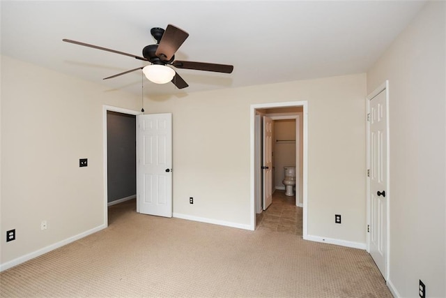 204 Maple Creek Chase, Woodstock, GA 30188 - unfurnished bedroom with ensuite bath, light colored carpet, baseboards, and a ceiling fan