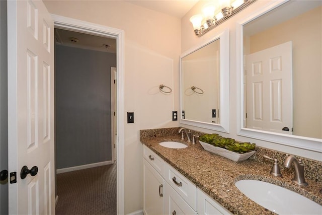 204 Maple Creek Chase, Woodstock, GA 30188 - full bathroom with double vanity, baseboards, and a sink