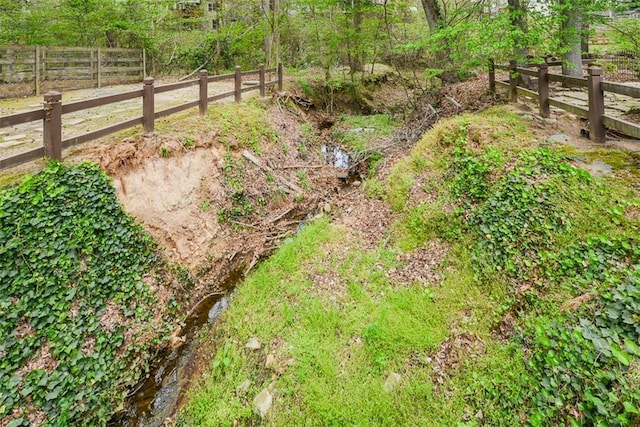204 Maple Creek Chase, Woodstock, GA 30188 - view of yard with a forest view and fence