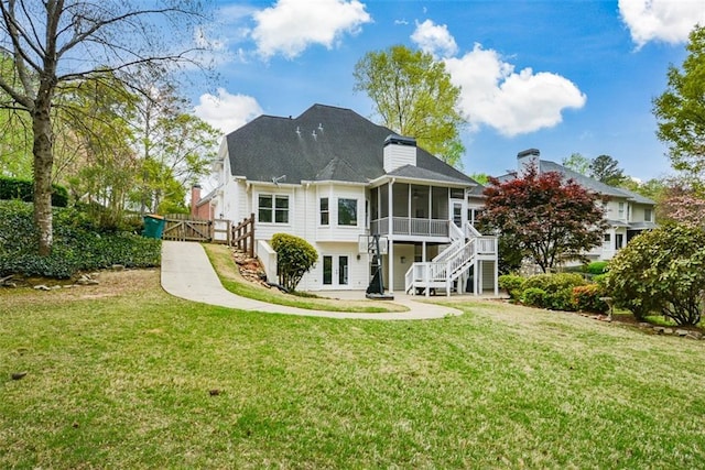 204 Maple Creek Chase, Woodstock, GA 30188 - back of property with a yard, stairway, and a sunroom