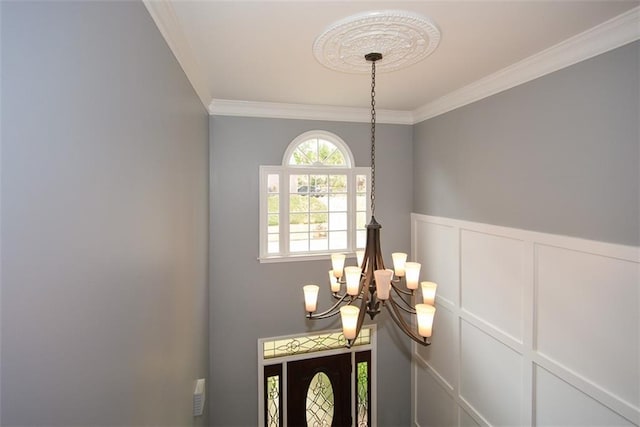 204 Maple Creek Chase, Woodstock, GA 30188 - room details featuring a decorative wall, a notable chandelier, crown molding, and a wainscoted wall