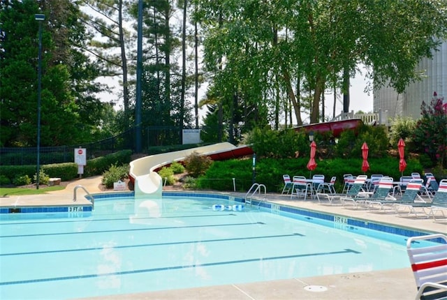 204 Maple Creek Chase, Woodstock, GA 30188 - community pool featuring a patio, a water slide, and fence