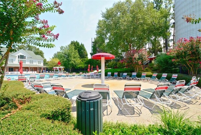 204 Maple Creek Chase, Woodstock, GA 30188 - view of patio with a community pool