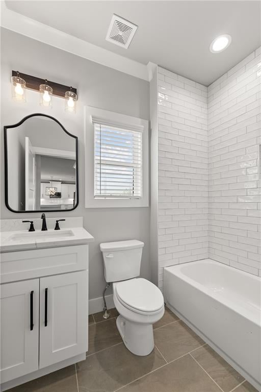 bathroom featuring tile patterned flooring, visible vents, baseboards, toilet, and vanity