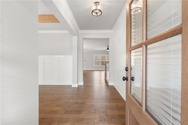 corridor with dark wood-style flooring, french doors, baseboards, and ornamental molding