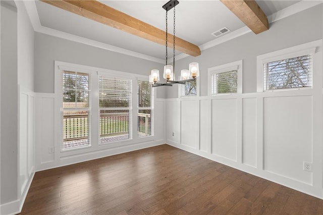 unfurnished dining area with a wealth of natural light, visible vents, beam ceiling, an inviting chandelier, and a decorative wall