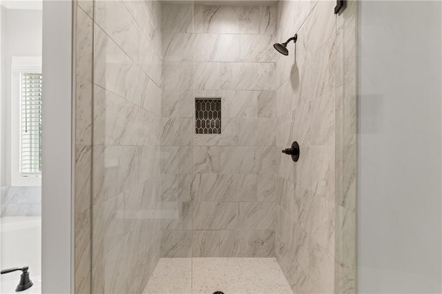 full bath featuring a shower stall