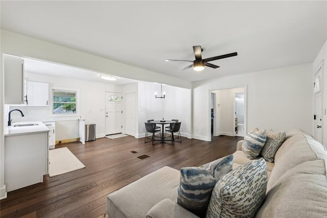 16064 Hopewell Rd, Alpharetta, GA 30004 - living room with dark wood-style flooring, a ceiling fan, and baseboards