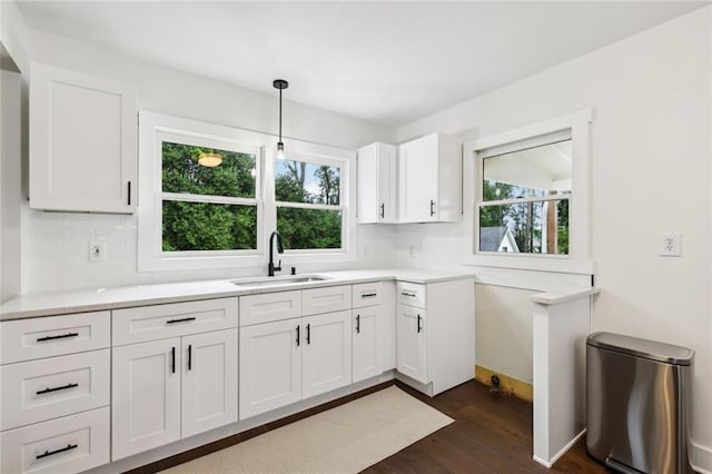 16064 Hopewell Rd, Alpharetta, GA 30004 - kitchen with dark wood-style flooring, white cabinets, light countertops, and decorative backsplash