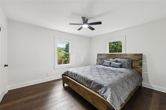 16064 Hopewell Rd, Alpharetta, GA 30004 - bedroom with multiple windows, dark wood-style flooring, baseboards, and a ceiling fan