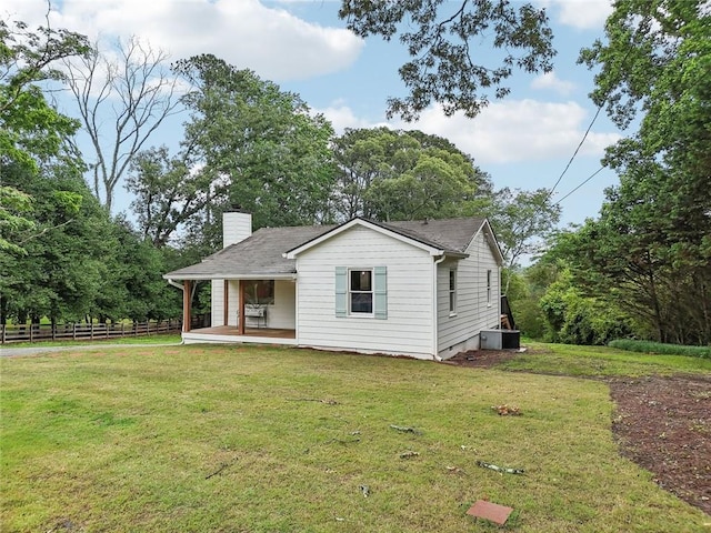 16064 Hopewell Rd, Alpharetta, GA 30004 - view of front facade featuring a chimney, covered porch, central AC, and roof with shingles