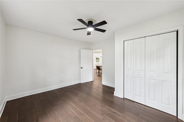 16064 Hopewell Rd, Alpharetta, GA 30004 - unfurnished bedroom with dark wood-type flooring, a closet, and ceiling fan
