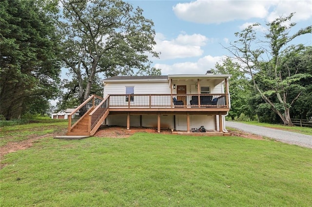 16064 Hopewell Rd, Alpharetta, GA 30004 - rear view of house with a lawn, gravel driveway, a wooden deck, and stairway