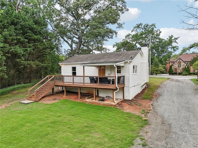 16064 Hopewell Rd, Alpharetta, GA 30004 - back of house with a chimney, a lawn, a deck, and stairs