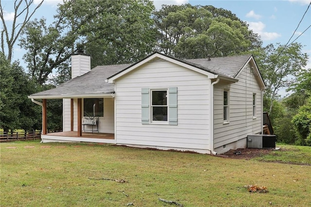16064 Hopewell Rd, Alpharetta, GA 30004 - view of front of home featuring a front lawn, a chimney, covered porch, and a shingled roof