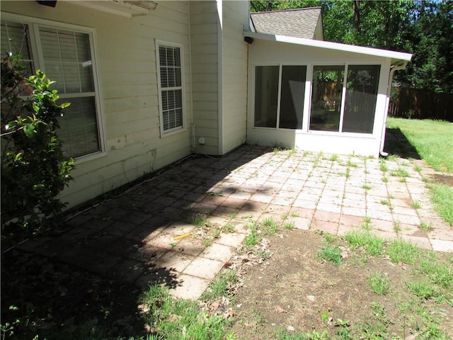 view of patio with a sunroom