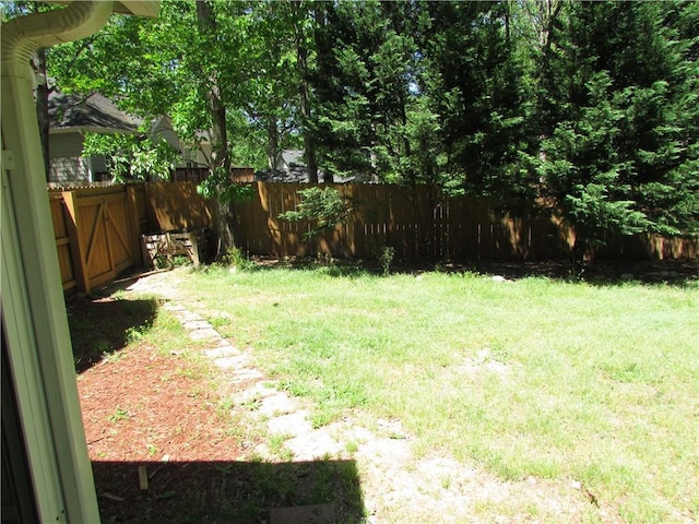 view of yard with a fenced backyard