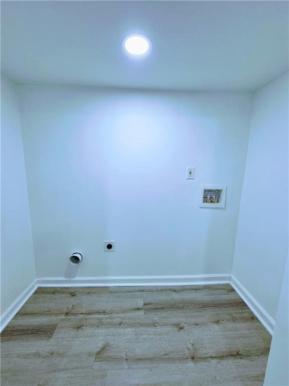 laundry room featuring washer hookup, hardwood / wood-style flooring, and hookup for an electric dryer