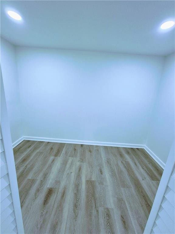 unfurnished room with light hardwood / wood-style flooring