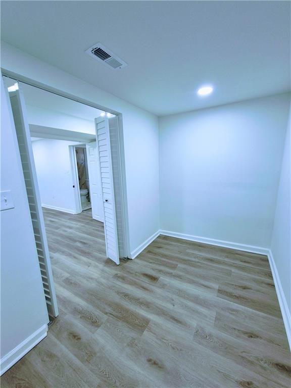 spare room with light hardwood / wood-style floors