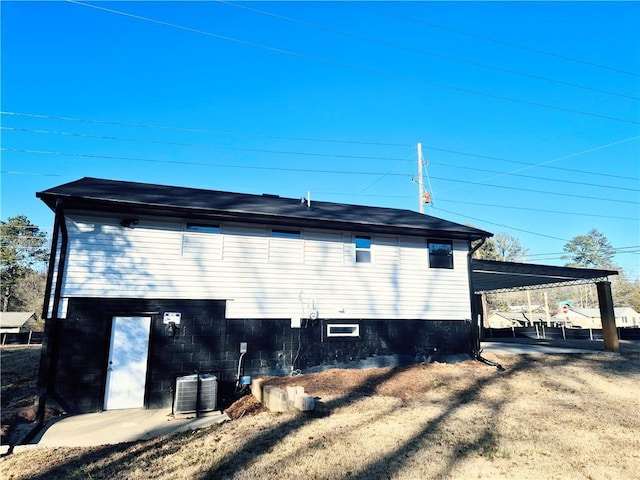 view of home's exterior featuring central AC and a patio