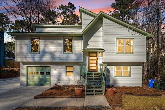 raised ranch featuring a garage