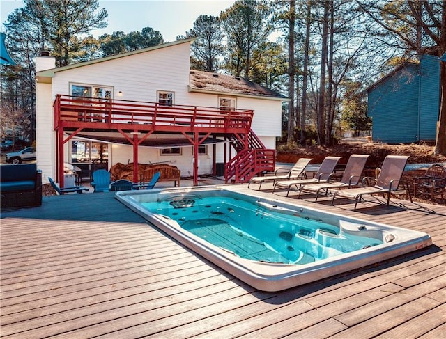 view of swimming pool with a wooden deck