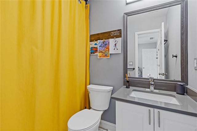 bathroom with vanity and toilet