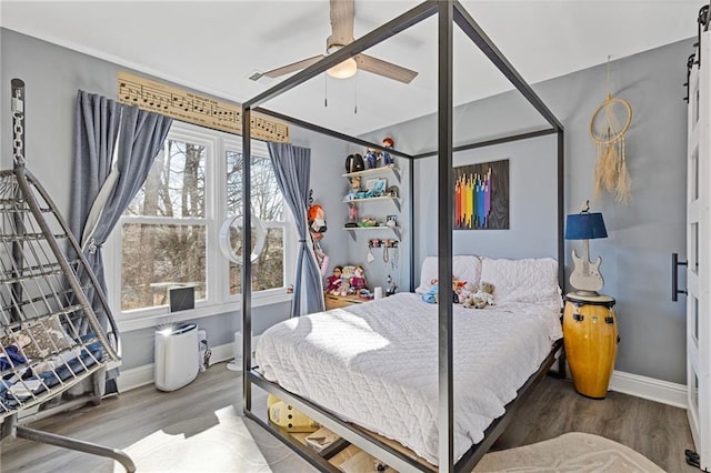 bedroom with hardwood / wood-style flooring and ceiling fan