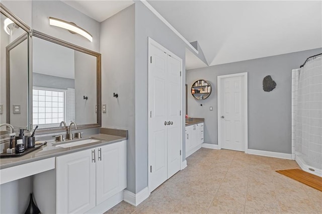 bathroom with vanity, tile patterned floors, and a shower with shower curtain