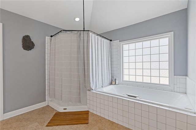 bathroom with independent shower and bath, lofted ceiling, and tile patterned floors