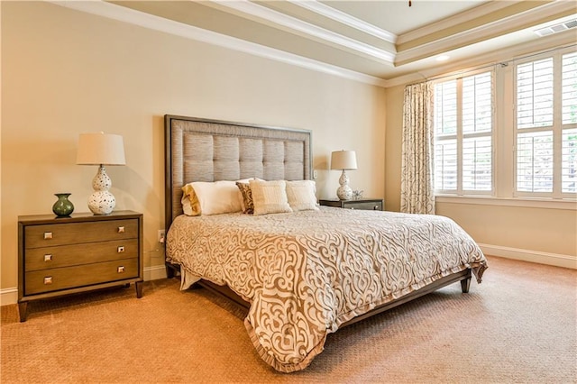 carpeted bedroom with crown molding, a tray ceiling, and multiple windows