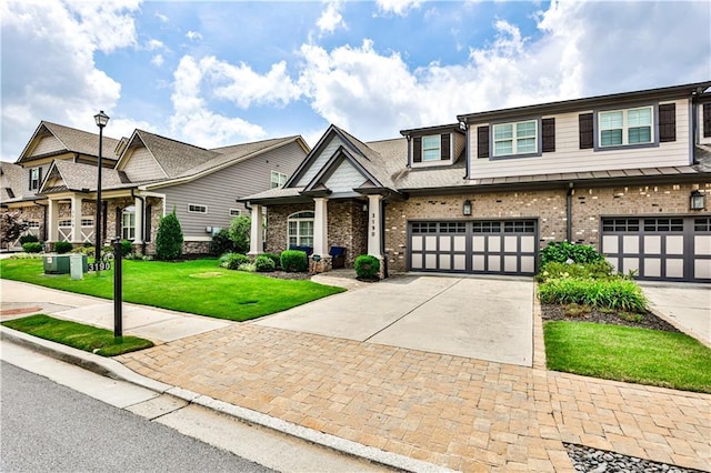 view of front of home with a front lawn and a garage