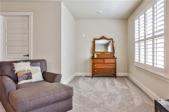 sitting room with light colored carpet