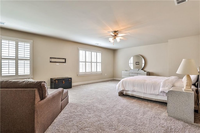 bedroom with light colored carpet and ceiling fan