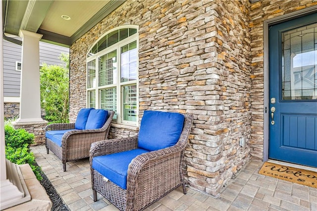 doorway to property featuring covered porch