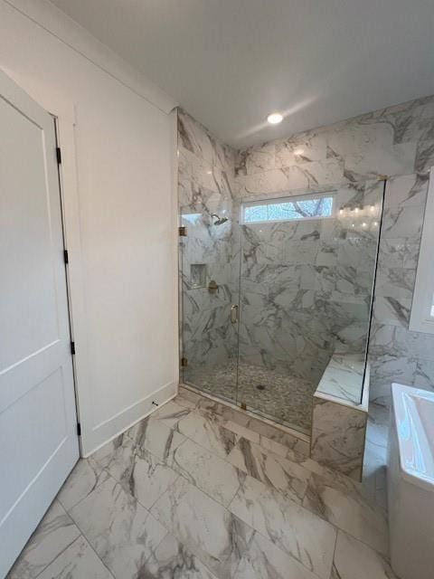 full bath featuring a washtub, recessed lighting, baseboards, marble finish floor, and a marble finish shower