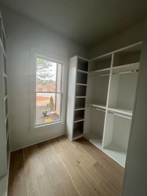 spacious closet with wood finished floors