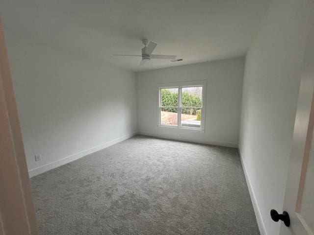 unfurnished room with carpet floors, ceiling fan, and baseboards