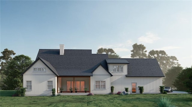 back of property featuring a lawn, a chimney, and roof with shingles