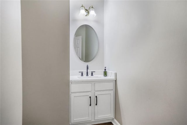 bathroom with vanity and baseboards