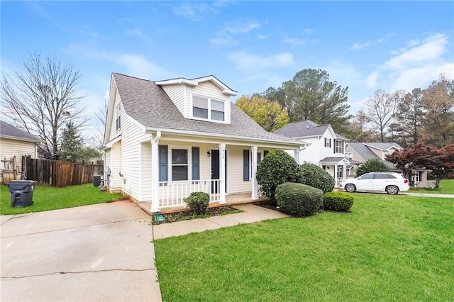 view of front of property with covered porch and a front yard