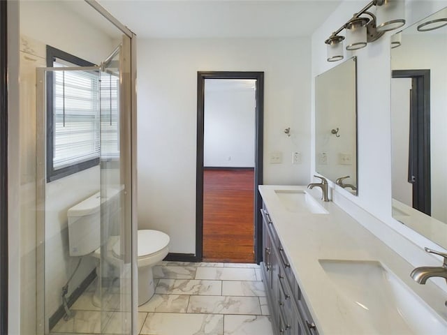 bathroom with vanity, a shower with shower door, wood-type flooring, toilet, and a chandelier