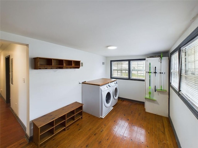 laundry room featuring hardwood / wood-style floors and washer and dryer