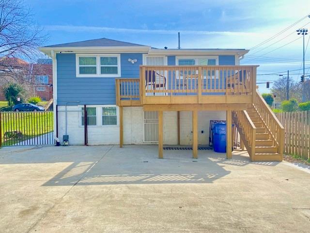 back of house featuring a deck