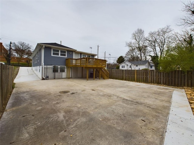 rear view of property with a wooden deck