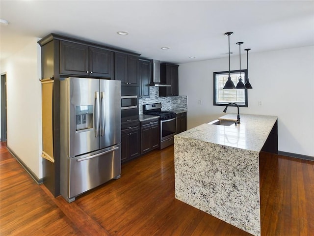 kitchen with dark hardwood / wood-style flooring, tasteful backsplash, stainless steel appliances, sink, and wall chimney range hood