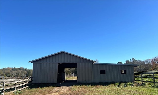 view of outbuilding with a rural view